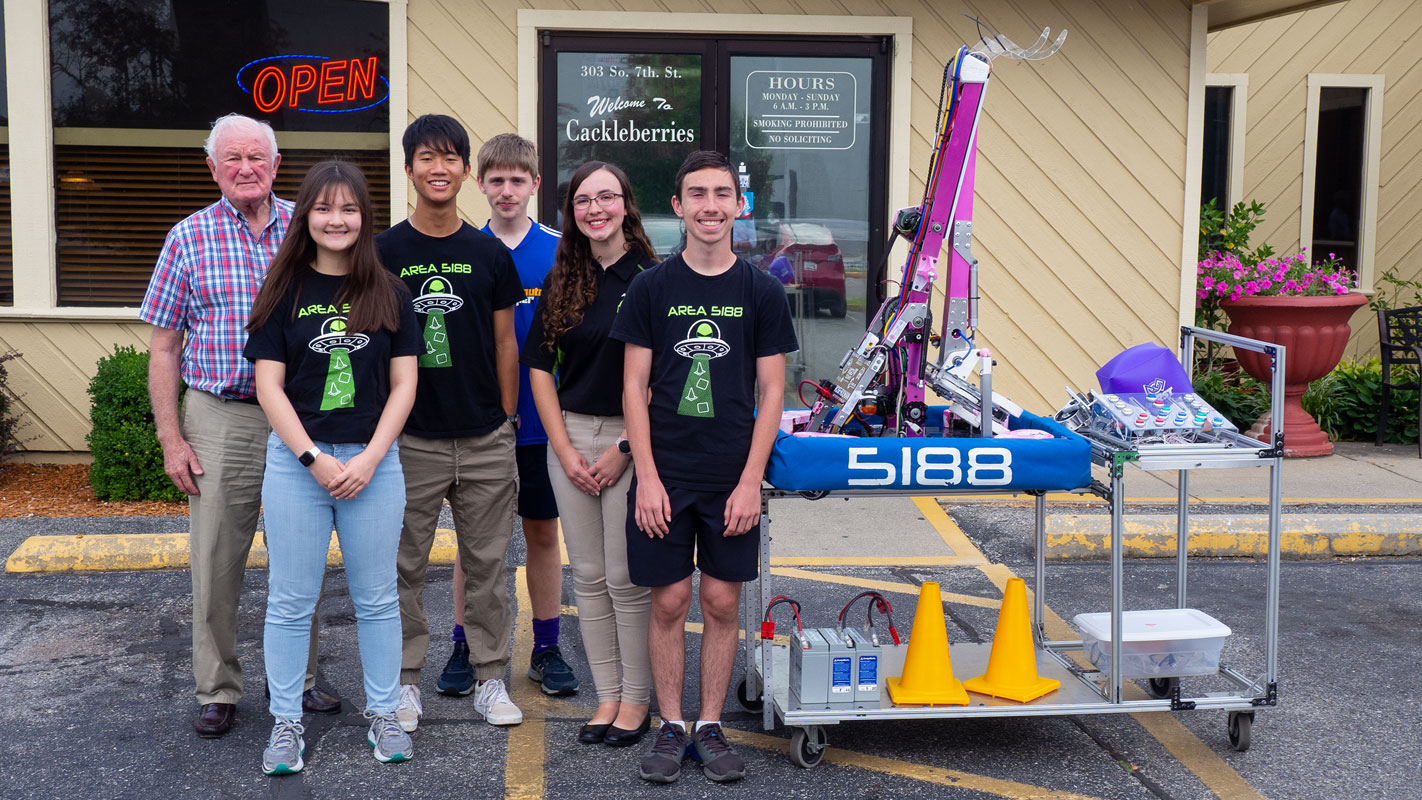 Area 5188 Robotics Team posing outside Cackleberries Restaurant after presenting to the Terre Haute Breakfast Optimist Club